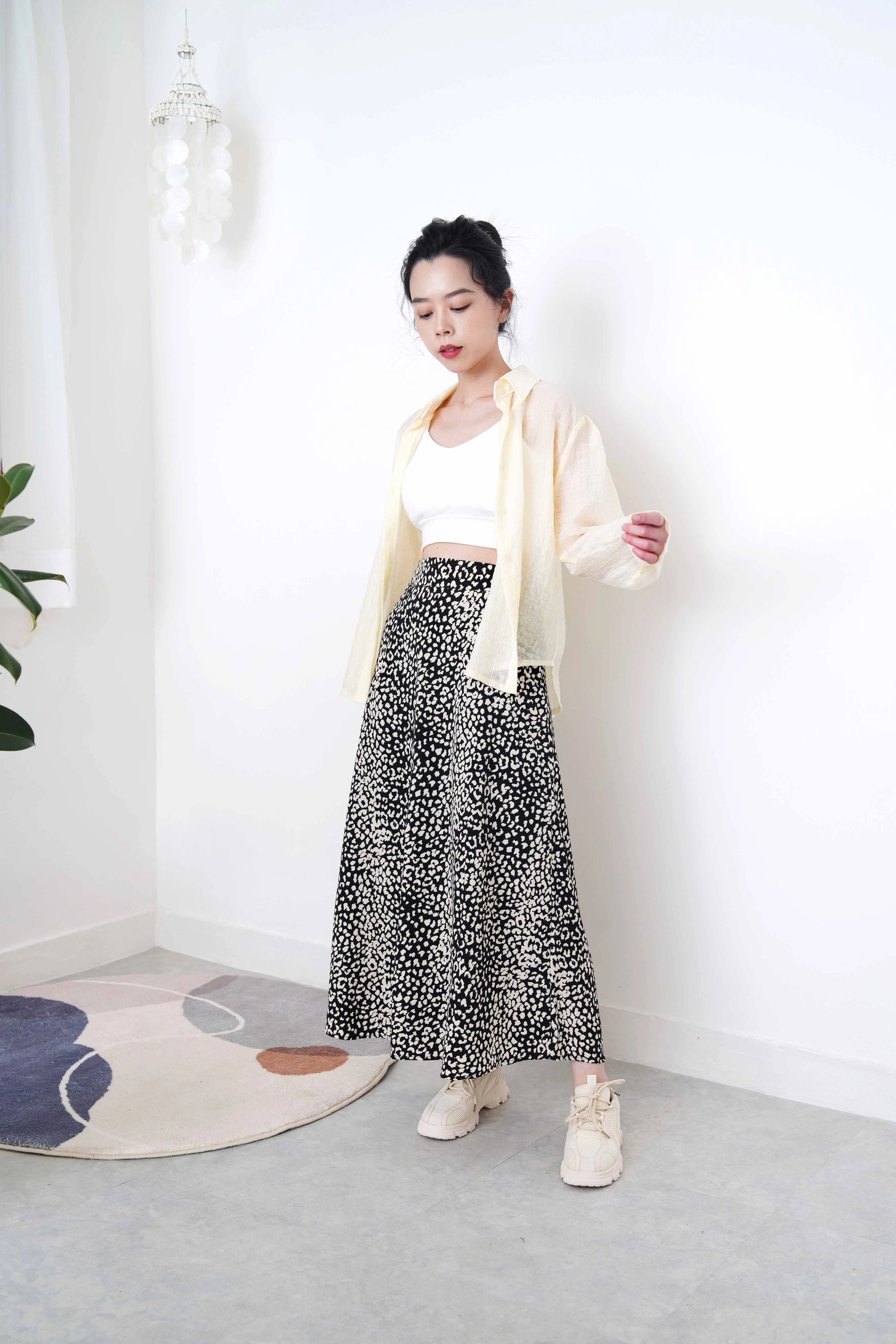 Pastel yellow sheer shirt in texture detail